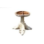 An interesting French table base, carved with palm fronds serving to support a glass top (