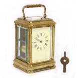 A French gilt brass carriage clock, early 20th Century, the white enamel dial with Roman numerals