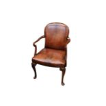 WITHDRAWN  A George II design mahogany elbow chair, upholstered in brown leather, on cabriole legs