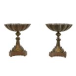 A pair of French Grand Tour bronze footed shell comports, 19th Century, on dolphin bases, 13cm