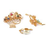 Three gem-set brooches, including a freshwater pearl and diamond flower brooch, one pearl deficient,