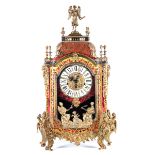 A Louis XVI design Boulle style bracket clock, the gilt metal mounted figural faux tortoiseshell