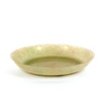 A Chinese carved jade dish, 20th Century, the shallow rounded sides rising from a straight foot with