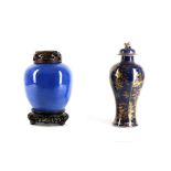 A Chinese porcelain baluster vase and cover, 19th Century, decorated in blue and gold with an