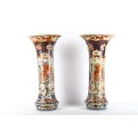 A pair of large Japanese Imari trumpet vases, 19th Century, each painted with temple lion dogs