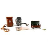 A Rolleiflex Automatic TLR 120 medium format camera, with additional lenses and instructions (2)