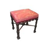 A Chippendale revival mahogany dressing stool, early 20th Century, with an upholstered seat, on a