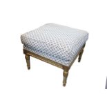 A Venetian dressing stool, 19th Century, with an upholstered seat, on a carved parcel gilt and