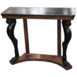 A Regency design rosewood and ebonised console table, on carved lion mask supports with paw feet,