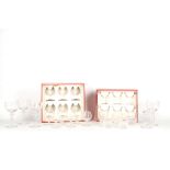 Two boxed sets of Baccarat glasses and a boxed set of Daum glasses, 20th Century, to include a set