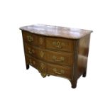 A French serpentine walnut commode, 18th Century, the variegated rouge marble top over two short and