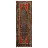 A north-west Persian runner, approx: 9ft.10in. x 3ft.4in. (299cm x 102cm)