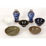 An interesting collection of seven Chinese porcelain and pottery items, to include a pair of