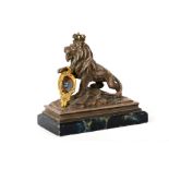 An silvered metal model of a lion supporting a heraldic crest, early 20th Century, the lion