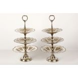 A pair of Italian silver plated graduated three tier cake stands, 20th Century, with cast scroll