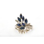 A sapphire and diamond dress ring, Set with marquise-cut sapphires and single-cut diamonds,