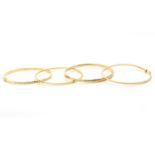 A group of four 9 carat gold bangles, UK hallmarks (4)