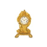 A MID 19TH CENTURY FRENCH GILT BRONZE ROCOCO STYLE DESK TIMEPIECE the relief cast case ornamented