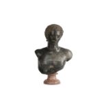 AFTER THE ANTIQUE: A GREY-VEINED BLACK MARBLE BUST