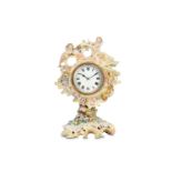 A LATE 19TH CENTURY PORCELAIN FIGURAL MANTEL CLOCK the Meissen style case in the Rococo style