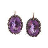 A pair of amethyst and diamond earrings