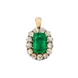 An emerald and diamond pendant