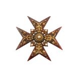 An early 19th century tortoiseshell Maltese cross,