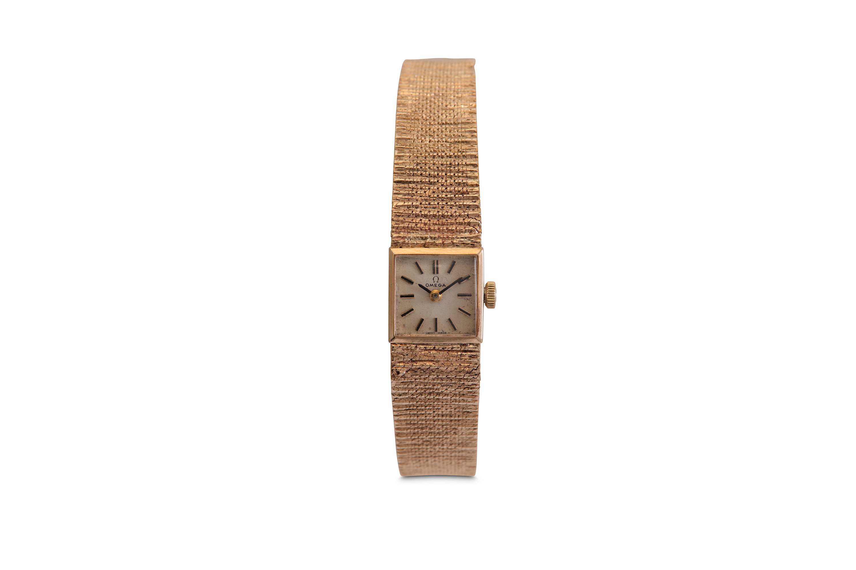 OMEGA. A LADIES 9K GOLD MANUAL WIND BRACELET WATCH. Date: C.1970’s. Serial number: 7115690.