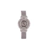CHOPARD. A FINE AND RARE 18K WHITE GOLD AND DIAMOND SET MANUAL WIND BRACELET WATCH. Case reference/