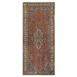 AN ANTIQUE NORTH-WEST PERSIAN KELLEH approx: 10ft.10in. x 4ft.8in.(329cm. x 142cm.) This carpet