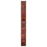 A VERY LONG HERIZ RUNNER, NORTH-WEST PERSIA approx: 24ft.3in. x 2ft.9in.(739cm. x 84cm.) The field