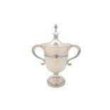 An early 20th century antique sterling silver twin-handled trophy cup, London 1938, by Wakely & Whee
