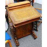 A Victorian walnut davenport, with fitted stationary compartment over slope front, with drawer to