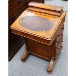 A late Victorian tulip banded figured walnut Davenport, with domed stationary compartment, leather