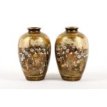 A pair of Japanese Satsuma baluster vases, Meiji period, late 19th Century, decorated to both