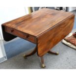 An mahogany sofa table, early 19th Century, with one dummy frieze drawer, raised on a central column