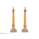 A pair of Corinthian column table lamps, the marble columns with silver plated capitols and square