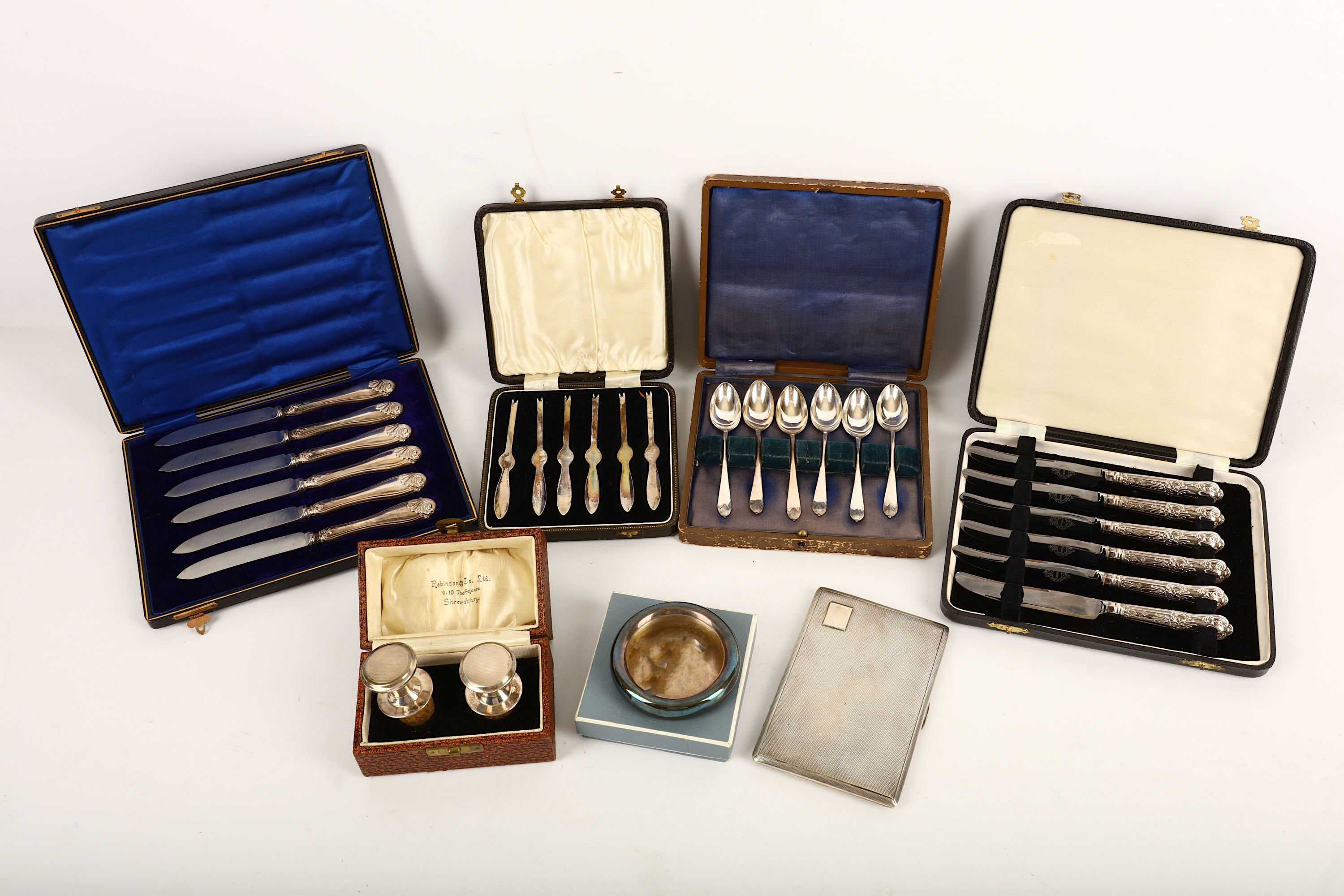 A mixed group of sterling silver, comprising a cigarette case, Birmingham 1919, a cased set of six