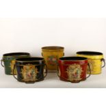 A set of four toleware buckets, with floral painted decoration and handles, 36cm wide; together with