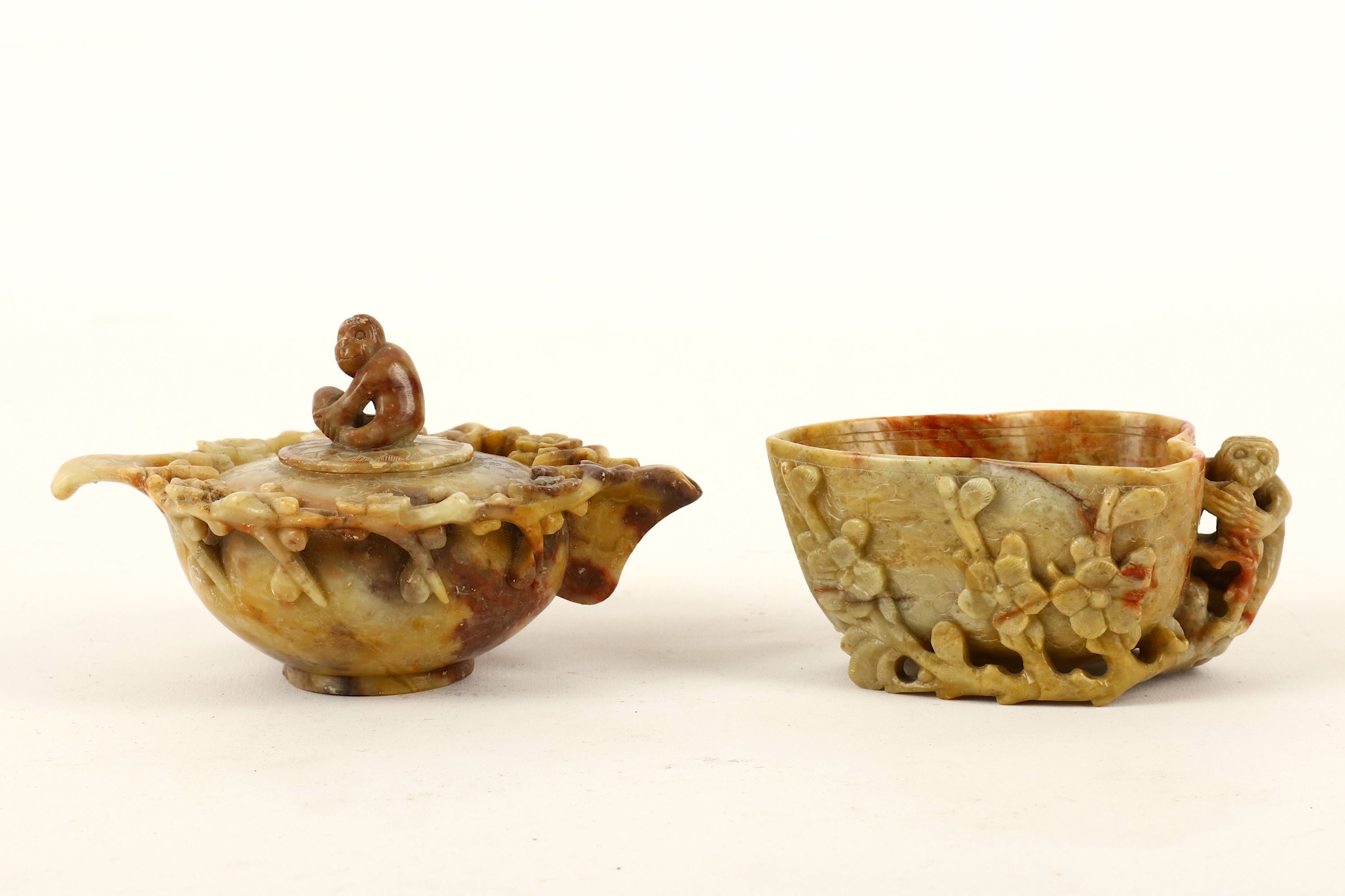 A carved Chinese soapstone 'monkey' libation cup and a water dropper, the cup in heart shape