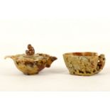 A carved Chinese soapstone 'monkey' libation cup and a water dropper, the cup in heart shape