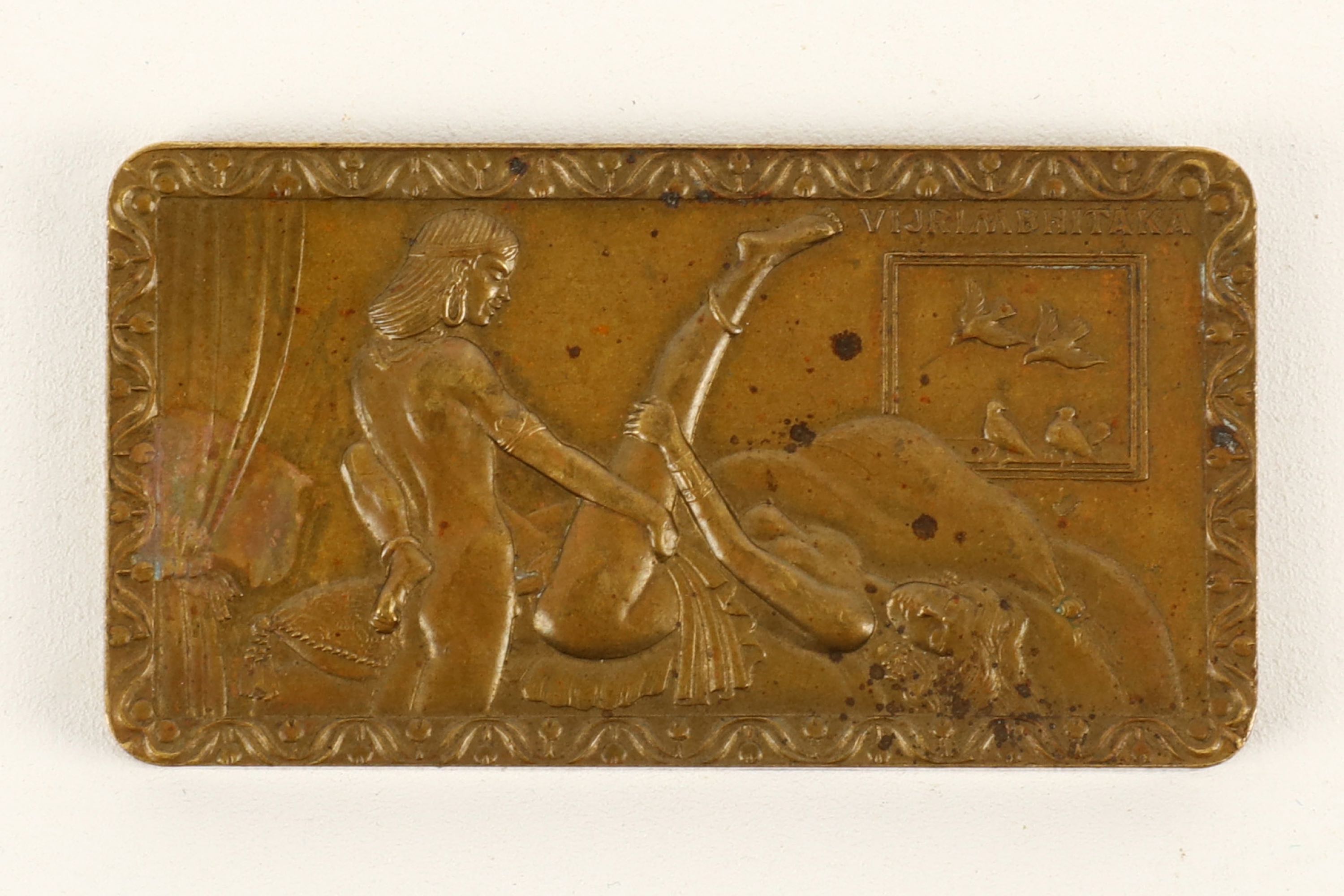 An Art Deco style Oriental miniature erotic bronze plaque, in European style, depicting a pair of