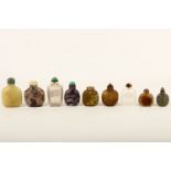 Nine Chinese carved hardstone snuff bottles (some with stoppers), 6-9.5cm high (9)