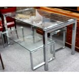 A matching set of glass-topped tables on chrome stands, 20th Century, 140 x 80cm, 115 x 55cm and