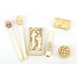 An interesting collection of small ivory items, late 19th Century, to include a miniature circular