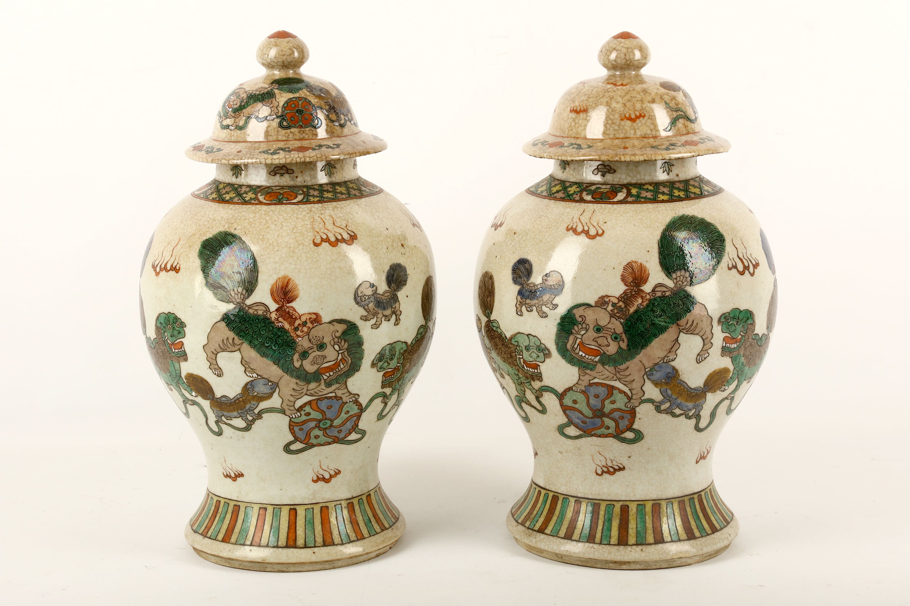 A pair of Chinese baluster crackle glazed vases and covers, Guangxu period, late 19th or early