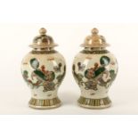 A pair of Chinese baluster crackle glazed vases and covers, Guangxu period, late 19th or early