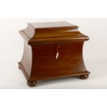 A Victorian mahogany cellarette, of rectangular sarcophagus form, the hinged top enclosing a