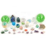 A collection of glass paperweights, 20th Century, in various patterns and sizes, to include two