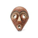 A GROUP OF WOOD MASKS, DEMOCRATIC REPUBLIC OF CONGO Including a Pende wood mask, with a red-